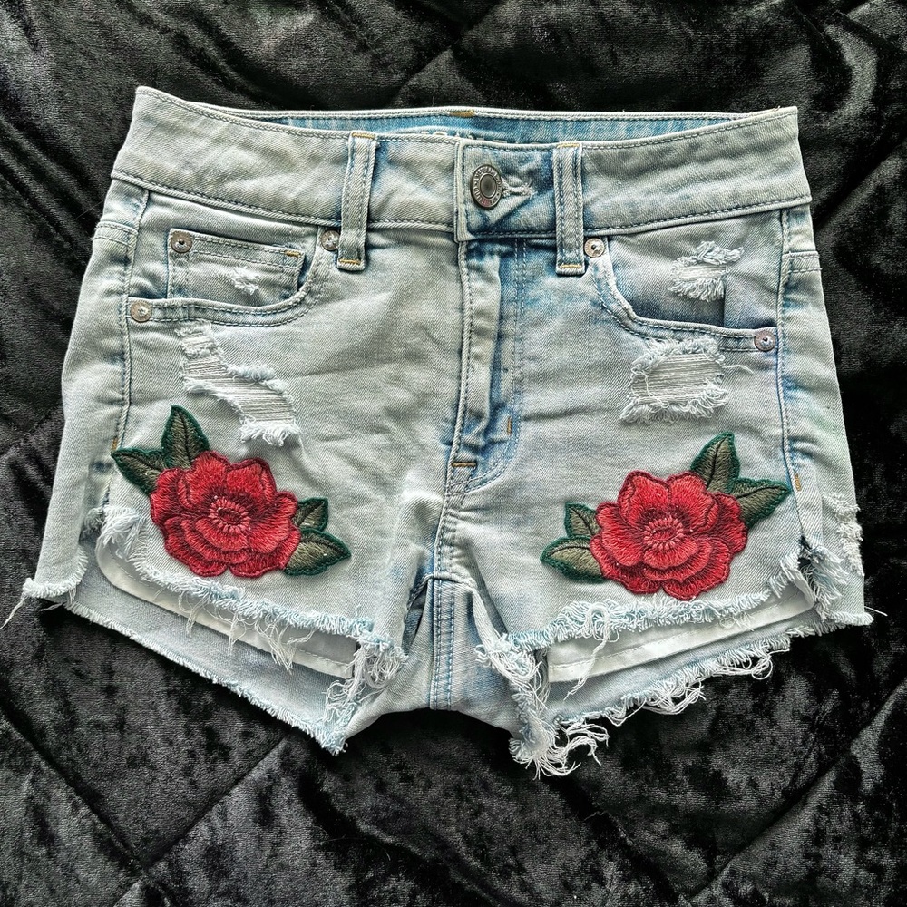 American Eagle light wash denim shorts with embroidered flowers